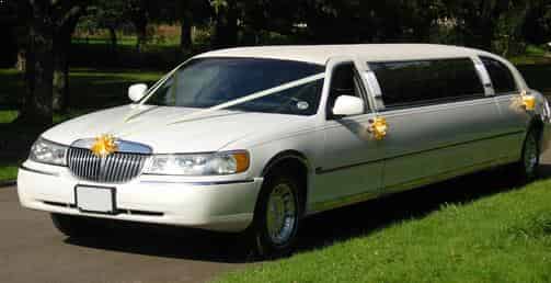 Wedding White Stretch ten passenger Limo, bride and groom